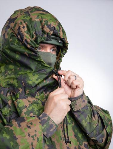 Särmä TST L6 Rain Poncho, M05 woodland camo. Helmet sized hood with drawcord.