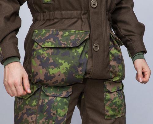 Särmä TST wool jacket, M05 woodland camo. The hem can be tightened and folded.