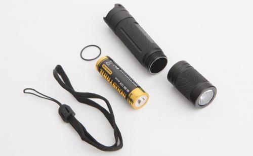 Fenix E12 flashlight. Works with a common AA-battery (not included).