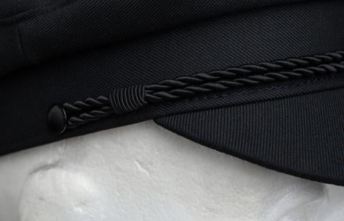 Särmä Skipper hat, black. A close-up on the braided cord and wool blend fabric.