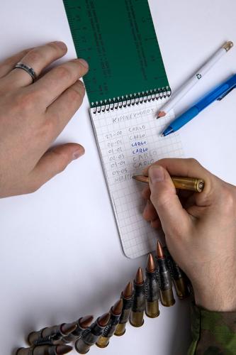 Särmä TST waterproof notebook. You can write with a pencil, pen or even the tip of a bullet.