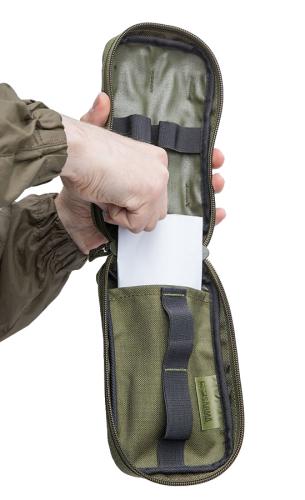 Särmä TST IFAK pouch. A piece of paper highlights the opening of the flat compartment.