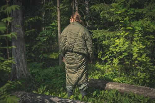 British jungle sleeping bag, surplus. Here worn as a thermal cloak.