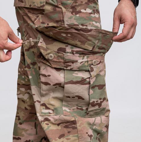US FRACU Pants, OCP, surplus. Cargo pockets with button closure. Note the adjustment cords.