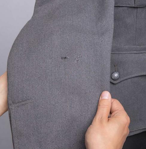 Finnish M36 wool tunic #12. A few holes on the arm.