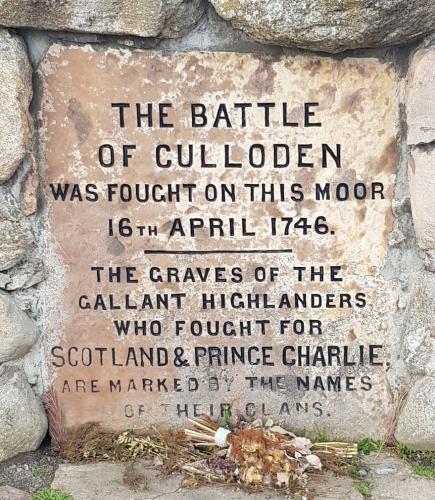 An engraving on stone: The battle of Culloden was fought on this moor 16th April 1746. The graves of the gallant highlanders who fought for Scotland & Prince Charlie are marked by the names of their clans.