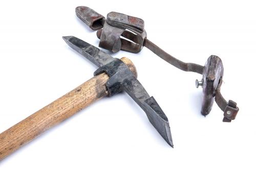 Swiss pickaxe with carrier, surplus. The leather carrier alone must have been silly expensive to make. Pictured also is the chisel-like end meant to cut roots.