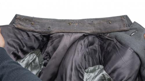 Finnish artillery officer M36 uniform with breeches. There's a lot of wear on the collar area.
