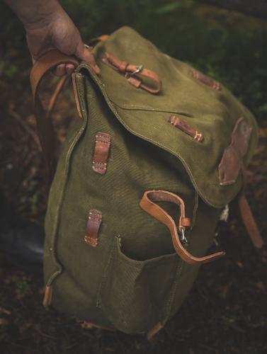 Romanian retro pack, green, surplus. On the left side there's the strap attachment points and a bottle holder.