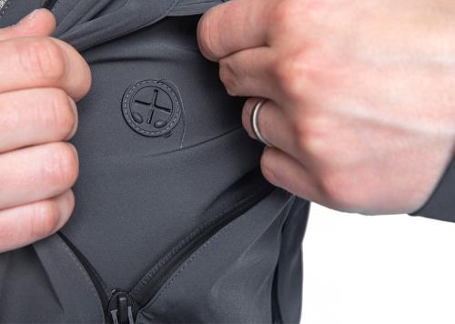 Särmä Hardshell Jacket. Passage for cables from the front pocket.