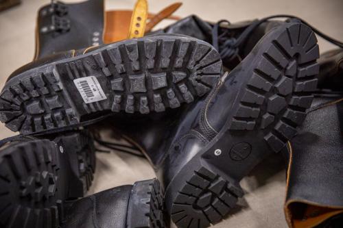 French BM65 double buckle boots, black, surplus, unissued. The sole pattern can vary a bit and the sole has gone a bit grey in the warehouse on some of these.