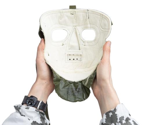 US Extreme Cold weather face mask, olive drab, surplus. On the inside, there's white and soft material that feels warm against the face.