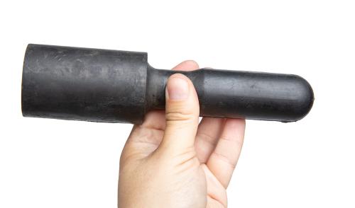 Hungarian Exercise Item, Rubber, Surplus. The reverse pincher hold.