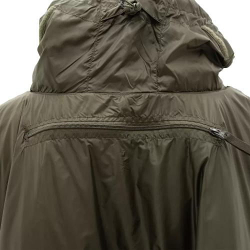 Carinthia Poncho System (CPS). At the back, there is a a pocket that contains a small bag for the detachable sleeping bag hood.