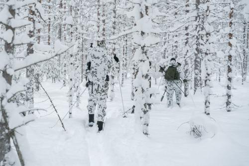 Särmä TST L7 Camouflage Anorak. On the left L5 Thermal Patrol Coverall, on the right L7 camouflage anorak and pants